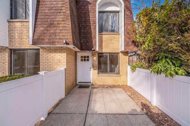 property entrance featuring a patio