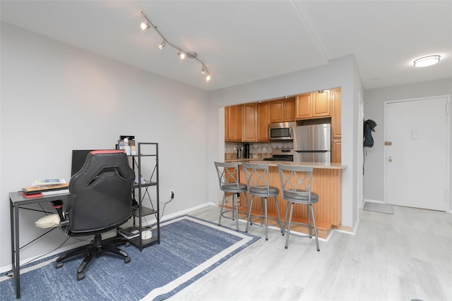 office space with light hardwood / wood-style floors