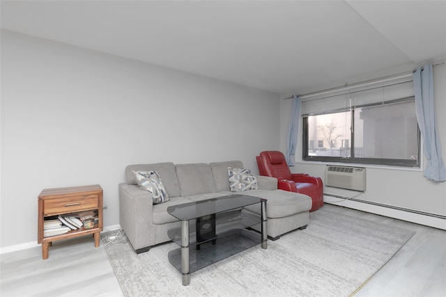 living room featuring a wall mounted air conditioner, baseboard heating, and light wood-type flooring