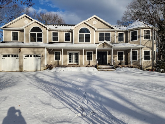 view of front of property with a garage and covered porch