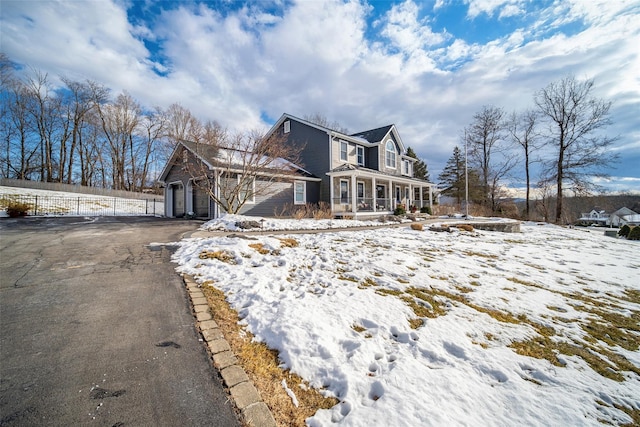 view of front of home with a garage and covered porch