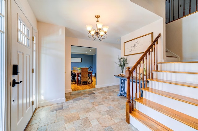 entryway with a notable chandelier