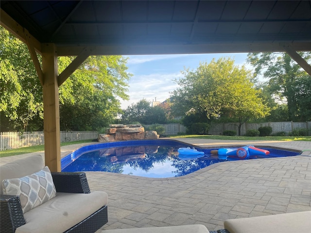 view of swimming pool featuring a patio area