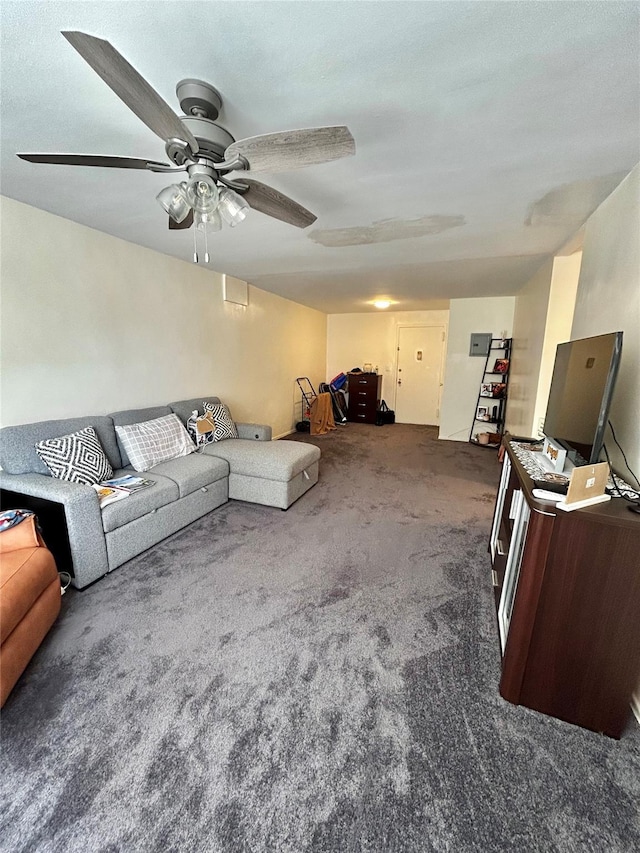 unfurnished living room featuring ceiling fan and dark colored carpet