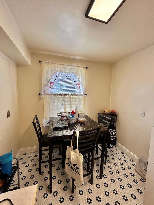 dining space with light carpet