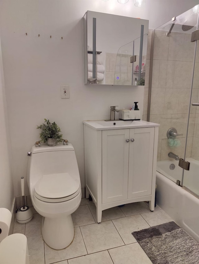 full bathroom featuring toilet, tile patterned floors, shower / bath combination with glass door, and vanity