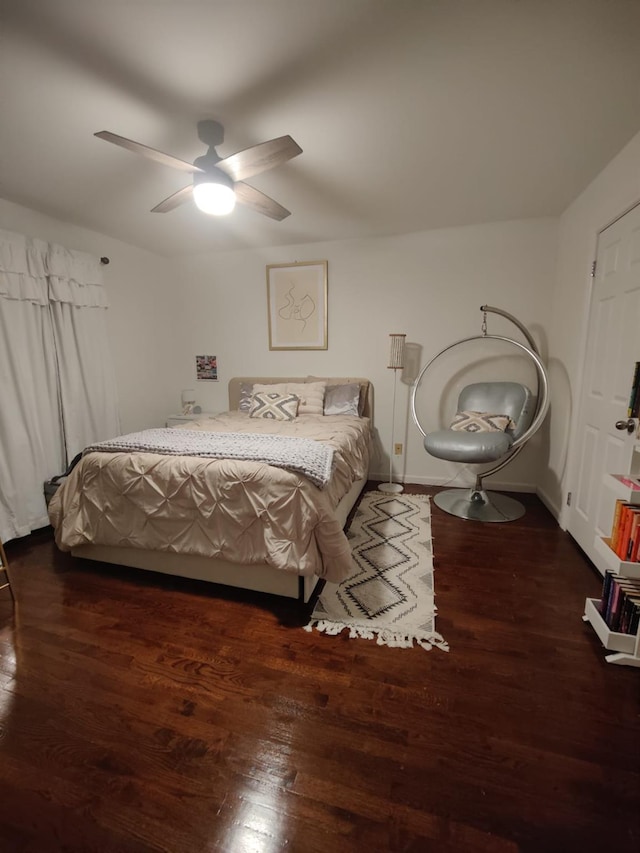 bedroom featuring dark wood-type flooring and ceiling fan