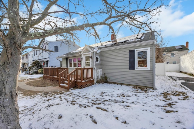 view of front of house with a wooden deck