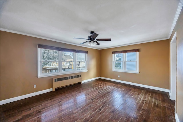 empty room with ornamental molding, radiator, dark wood-type flooring, and ceiling fan