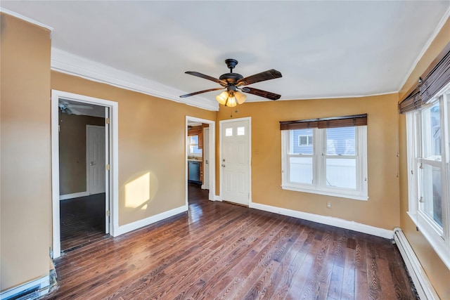 unfurnished room with baseboard heating, ceiling fan, dark hardwood / wood-style floors, and crown molding