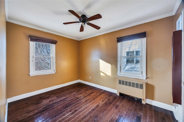 spare room with radiator, crown molding, dark wood-type flooring, and ceiling fan