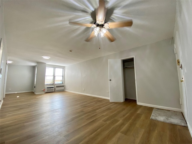 unfurnished room with wood-type flooring and ceiling fan