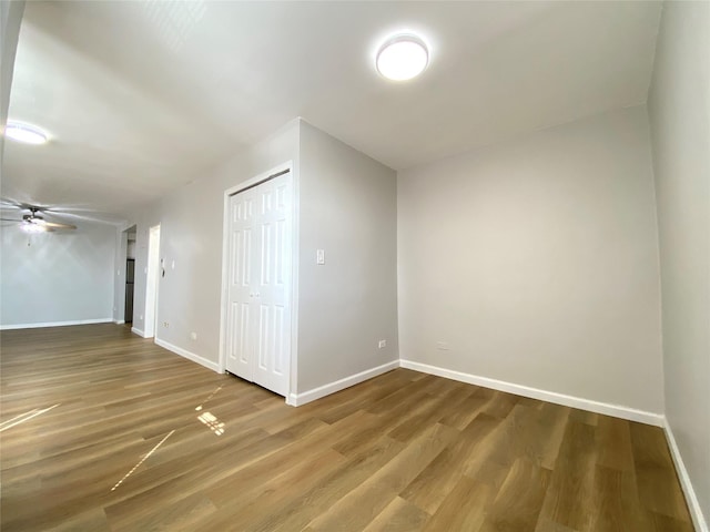 bonus room with ceiling fan and hardwood / wood-style floors