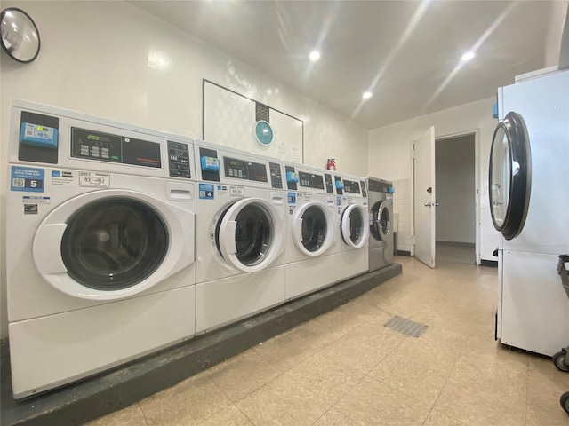 clothes washing area featuring washer and clothes dryer