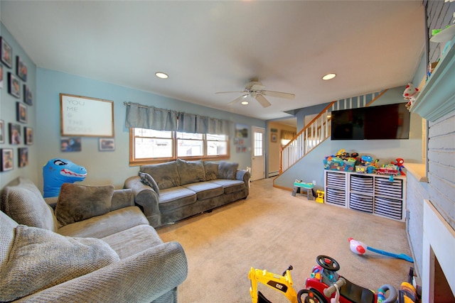 living room featuring ceiling fan and carpet