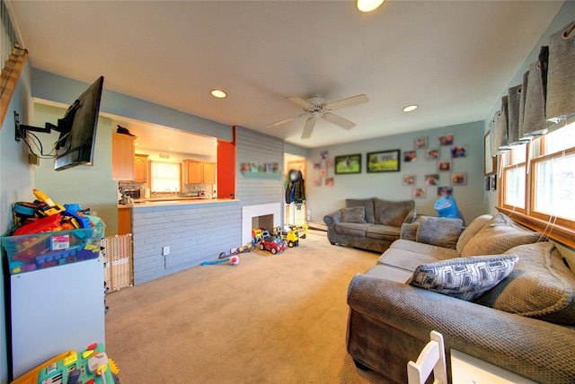 living room featuring light colored carpet and ceiling fan