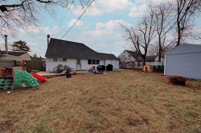 view of yard featuring a playground and a deck