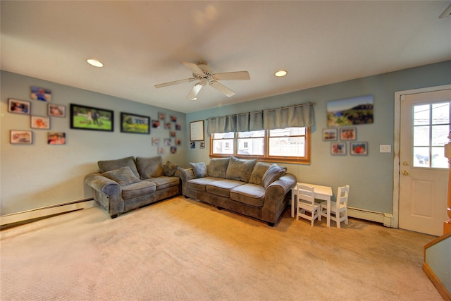 living area with a baseboard heating unit, recessed lighting, light carpet, and ceiling fan