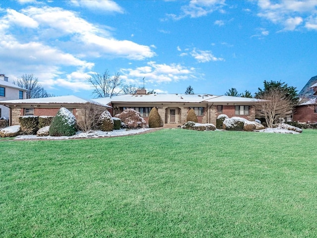 ranch-style home with a front lawn