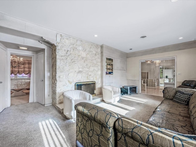 living room with crown molding, a stone fireplace, and carpet floors