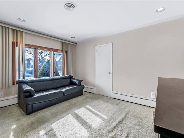 carpeted living room with crown molding and baseboard heating