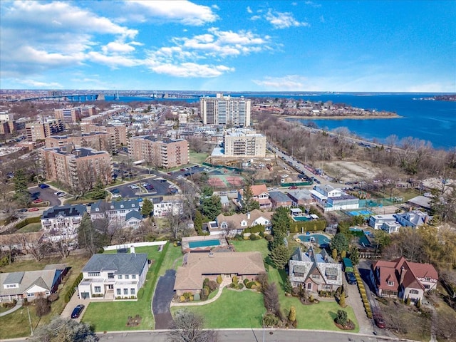 birds eye view of property with a city view and a water view