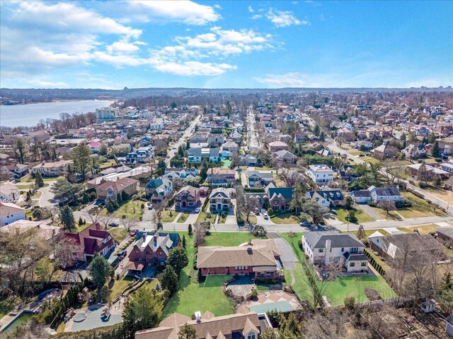 aerial view with a residential view and a water view