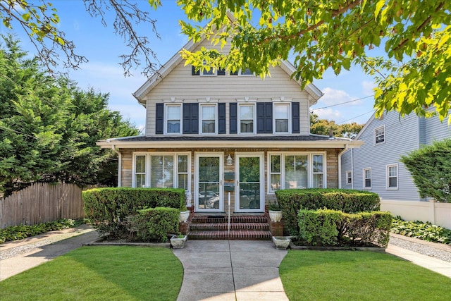 front of property featuring a front lawn