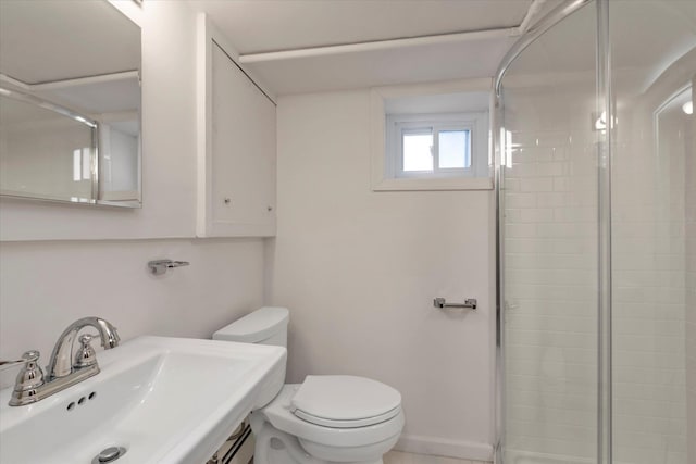 bathroom with toilet, an enclosed shower, and sink