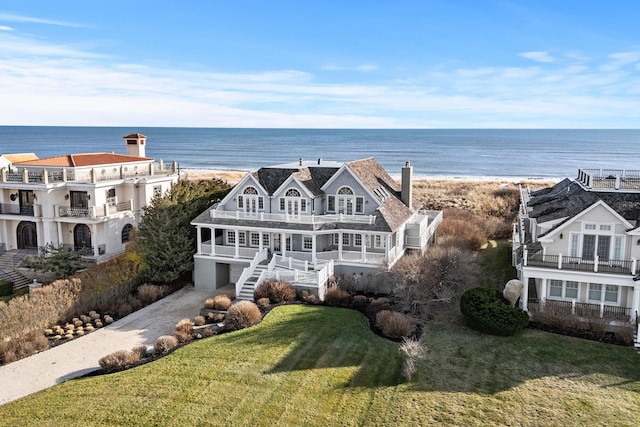 exterior space featuring a water view and a front yard