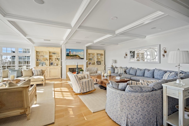 living room with hardwood / wood-style flooring, beam ceiling, coffered ceiling, ornamental molding, and built in shelves