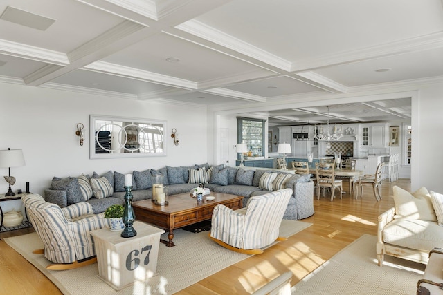 living room with beamed ceiling, coffered ceiling, and light wood-type flooring