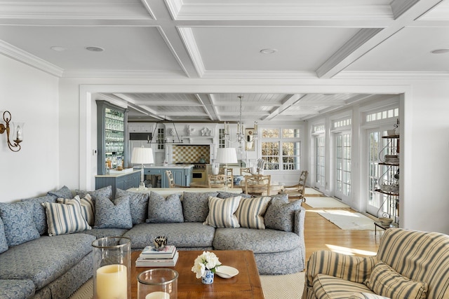 living room featuring crown molding, a healthy amount of sunlight, coffered ceiling, and beam ceiling