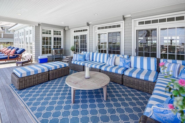 view of patio / terrace featuring a wooden deck and an outdoor living space