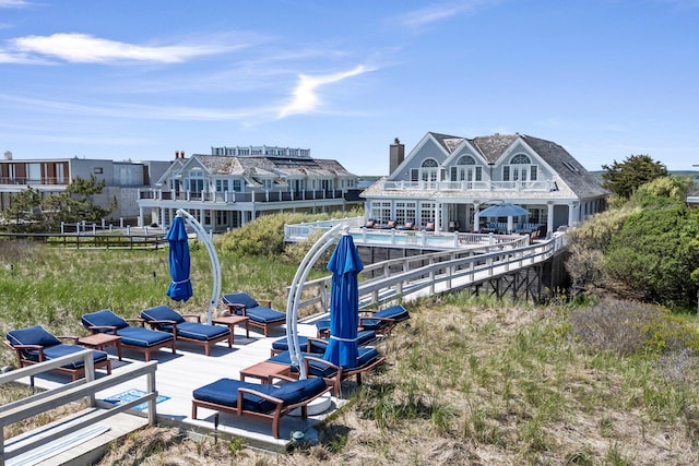 47 Dune Rd, East Quogue, NY 11942 - dock featuring a wooden deck and an outdoor pool