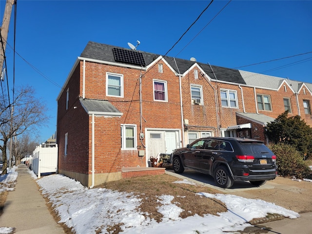 view of front of house with solar panels