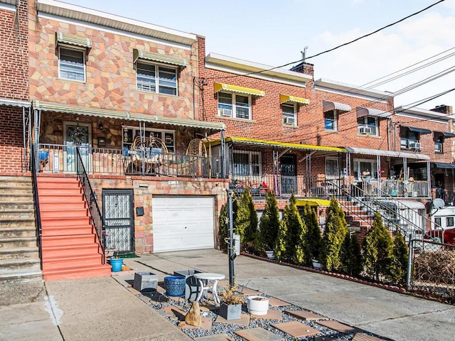 townhome / multi-family property featuring a garage