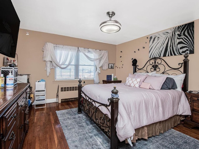 bedroom featuring dark hardwood / wood-style floors and radiator heating unit