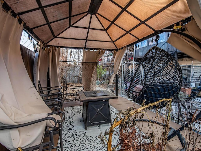 view of patio featuring a gazebo and an outdoor fire pit