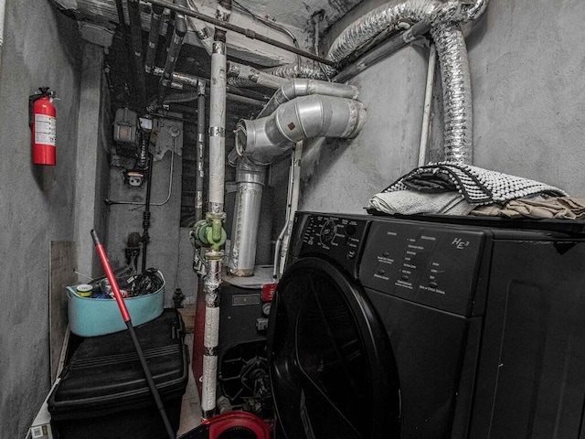 utility room featuring washer / dryer