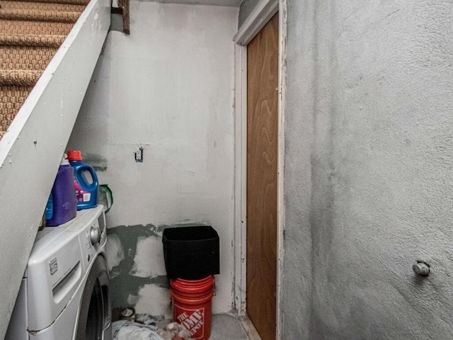 laundry room featuring washing machine and clothes dryer