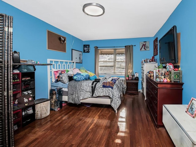 bedroom featuring dark hardwood / wood-style flooring