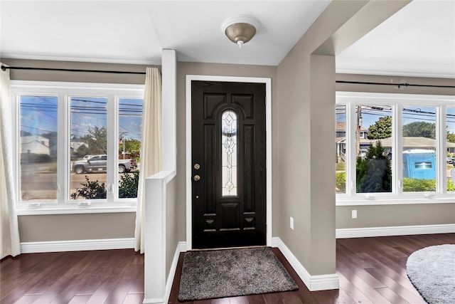 foyer with dark hardwood / wood-style floors