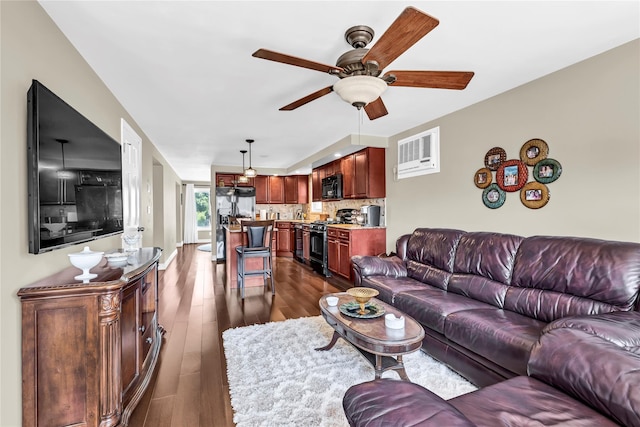 living room featuring dark hardwood / wood-style floors and ceiling fan