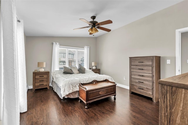 bedroom with lofted ceiling, dark hardwood / wood-style floors, and ceiling fan