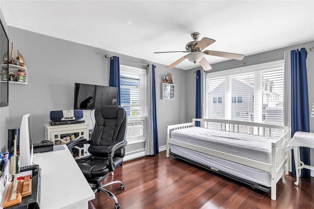 bedroom with cooling unit, ceiling fan, dark hardwood / wood-style floors, and a baseboard heating unit