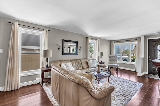 living room with baseboards and dark wood finished floors