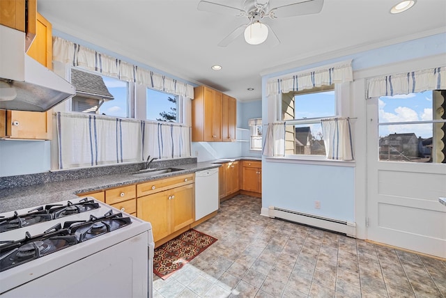 kitchen featuring baseboard heating, white appliances, sink, and a wealth of natural light