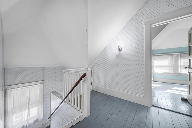 bonus room with vaulted ceiling and hardwood / wood-style floors