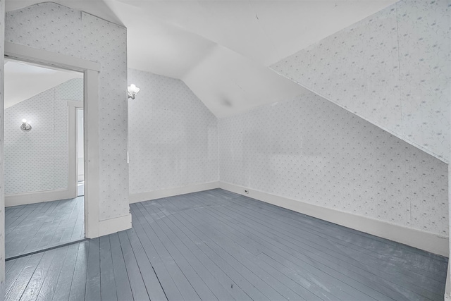 bonus room featuring lofted ceiling and hardwood / wood-style floors